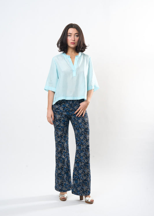 Pale Blue Silk Tee shown on model, side view