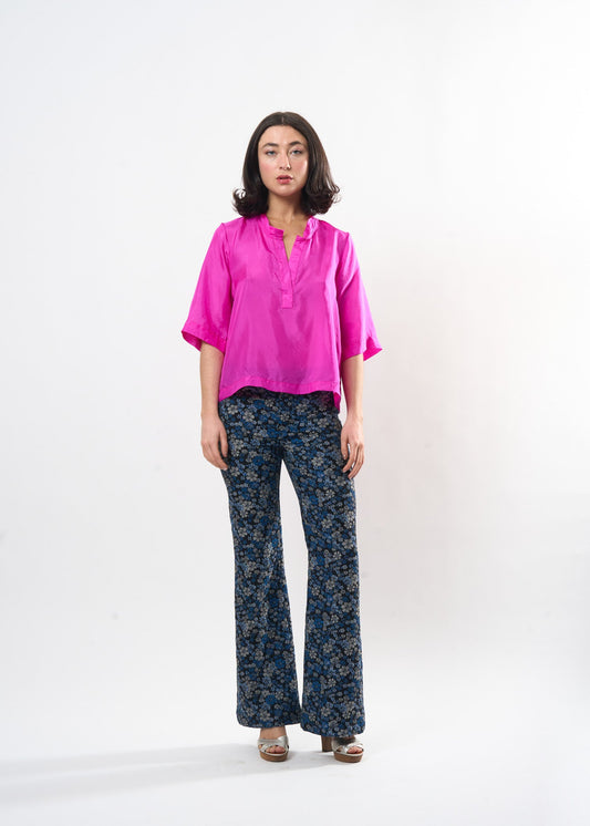 Fuchsia Silk Tee shown on model, side view