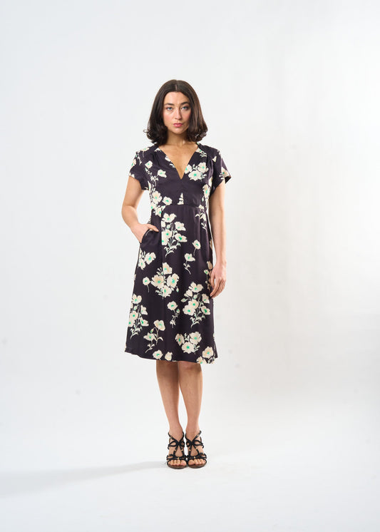Woman wearing a floral dress on a white background