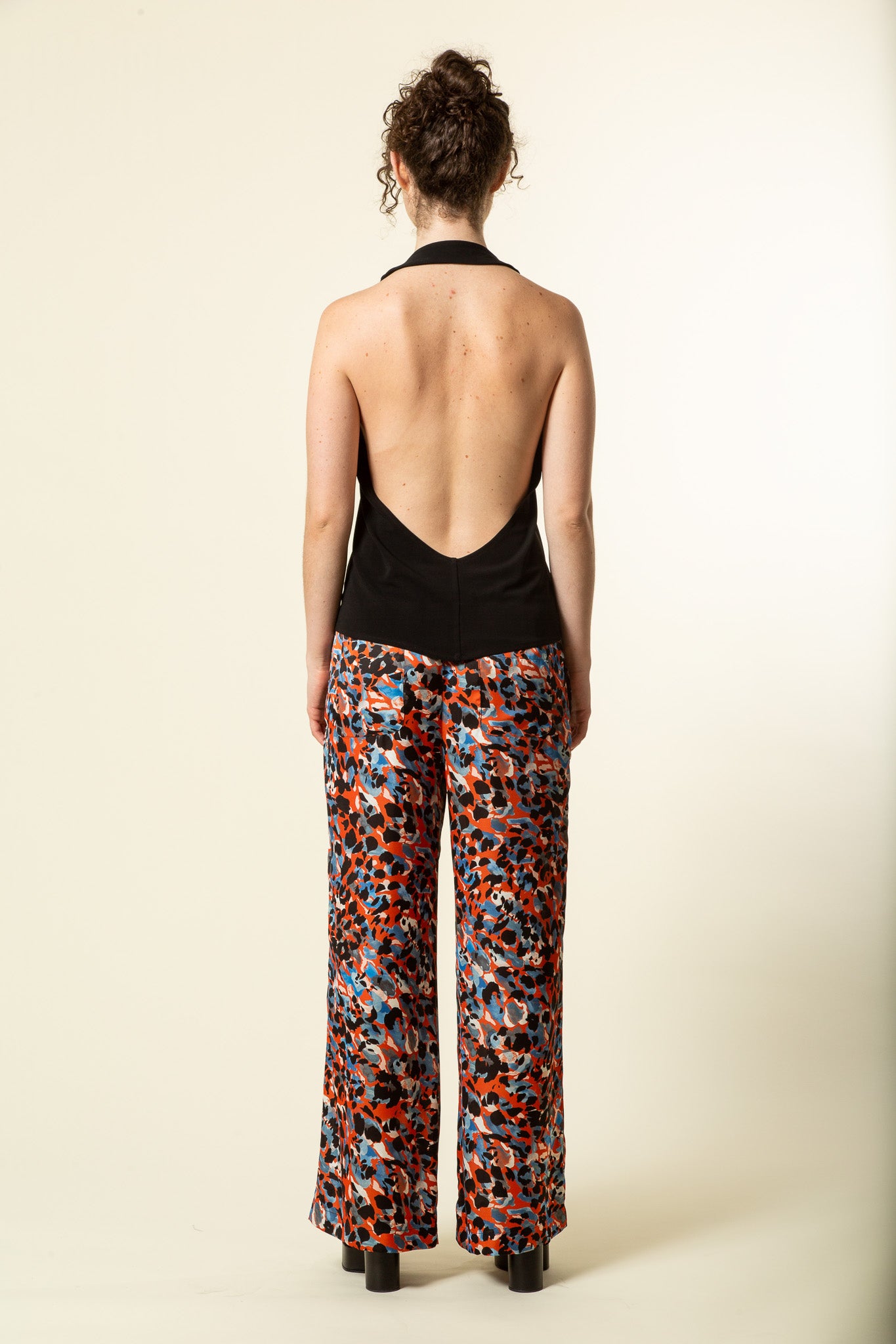 Backless black silky halter top