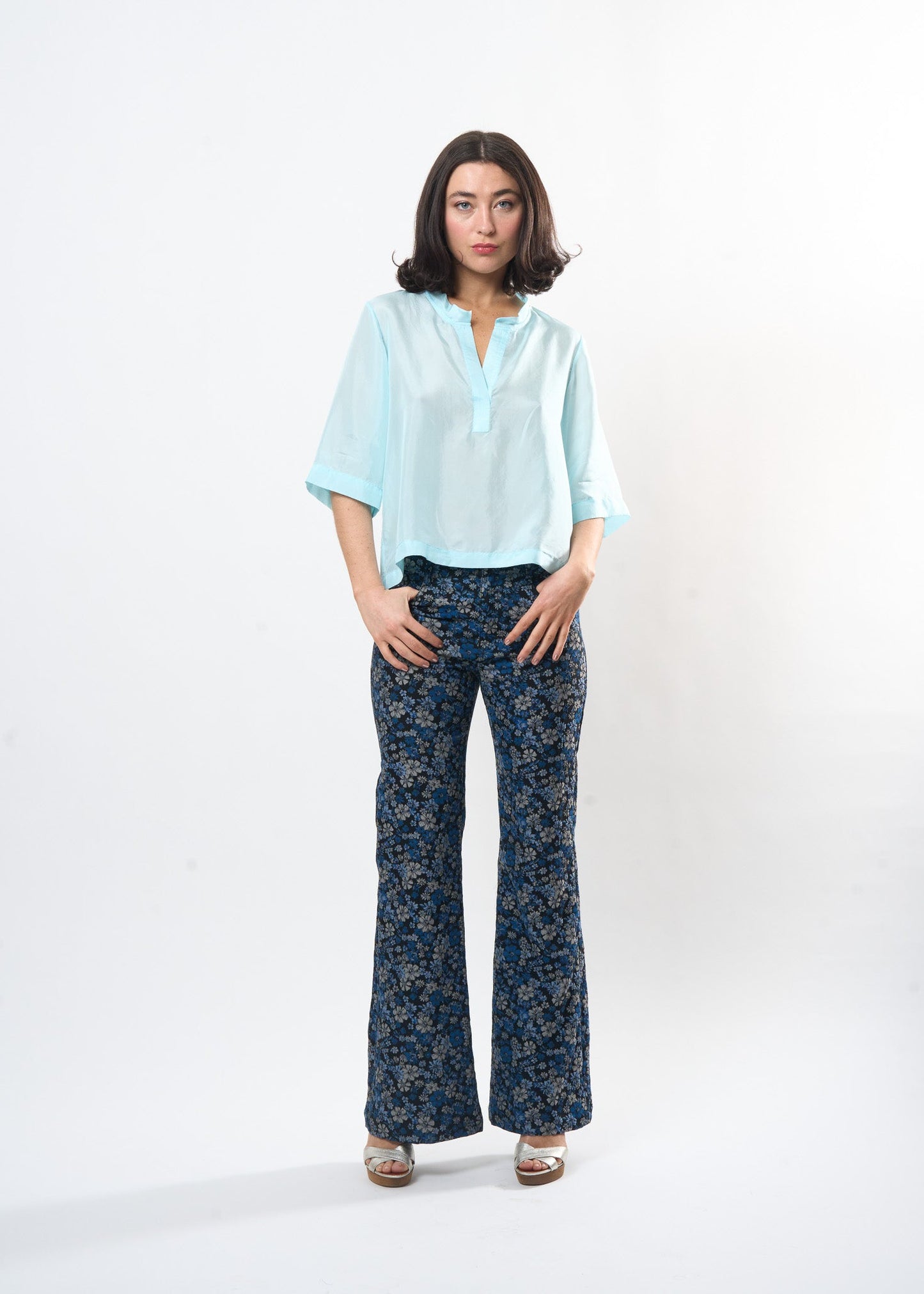 Pale Blue Silk Tee shown on model, back view