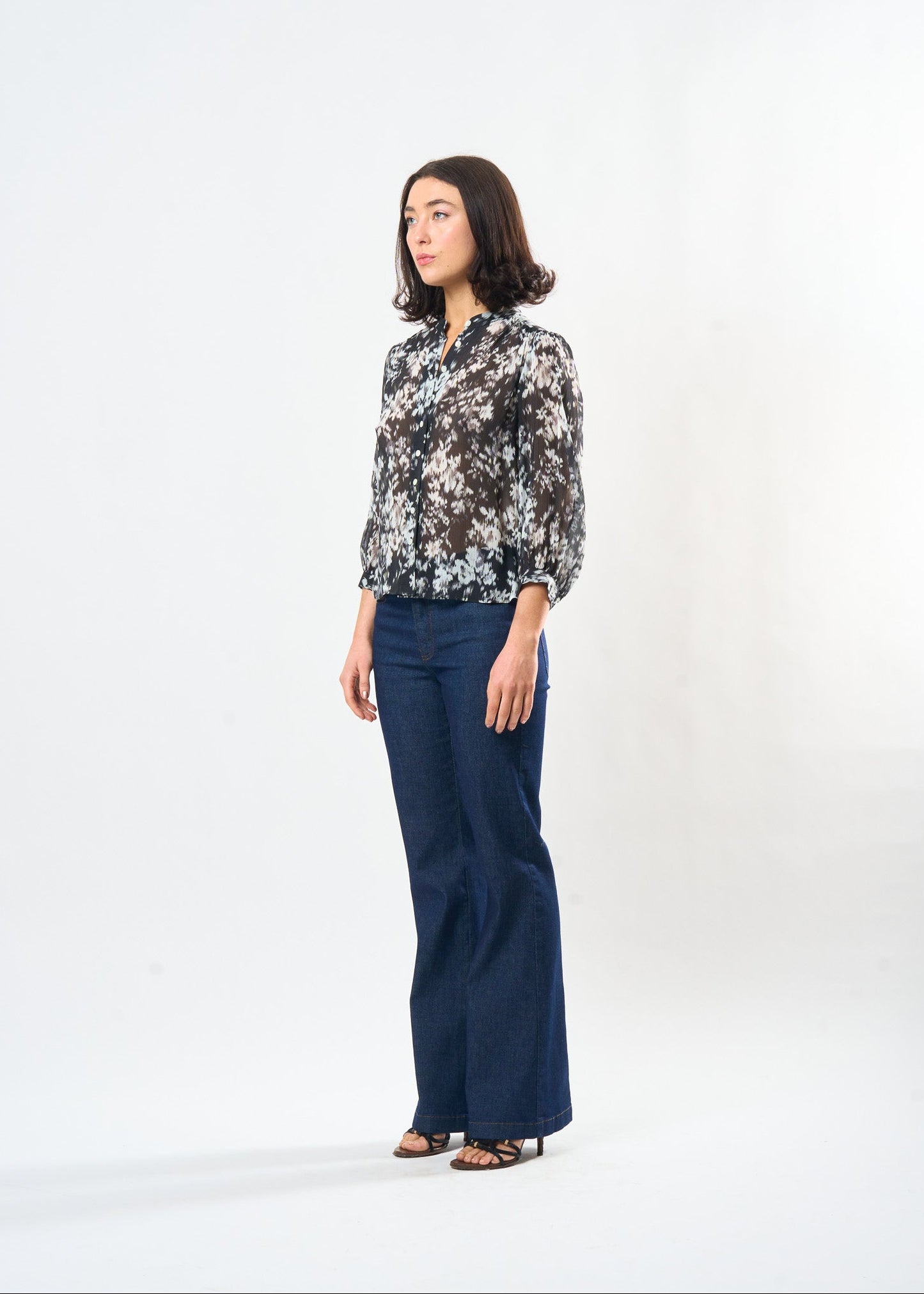 Black & White Ikat Studio Top shown on model, back view