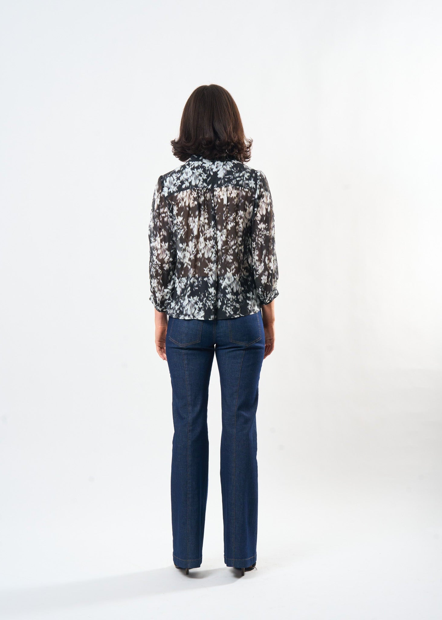 Black & White Ikat Studio Top shown on model, alternate view