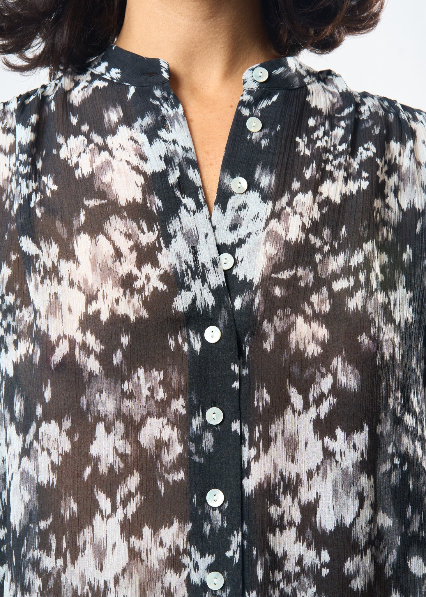 Black & White Ikat Studio Top shown on model, close-up detail