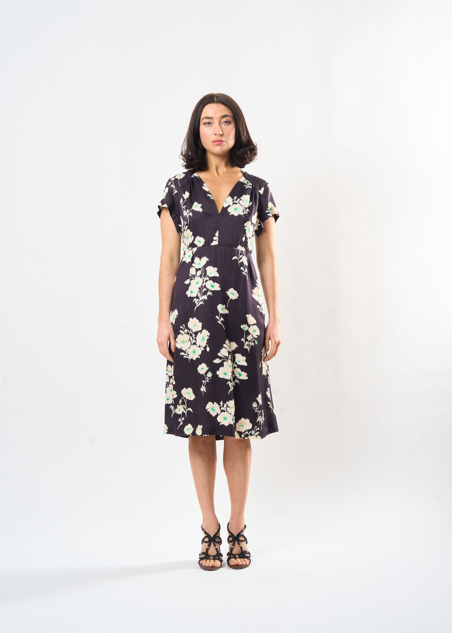 Woman wearing the Maria Cecilia Shadow Floral Sofia Dress, front view