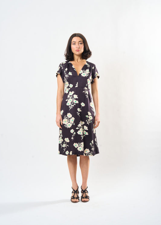 Woman wearing the Maria Cecilia Shadow Floral Sofia Dress, front view