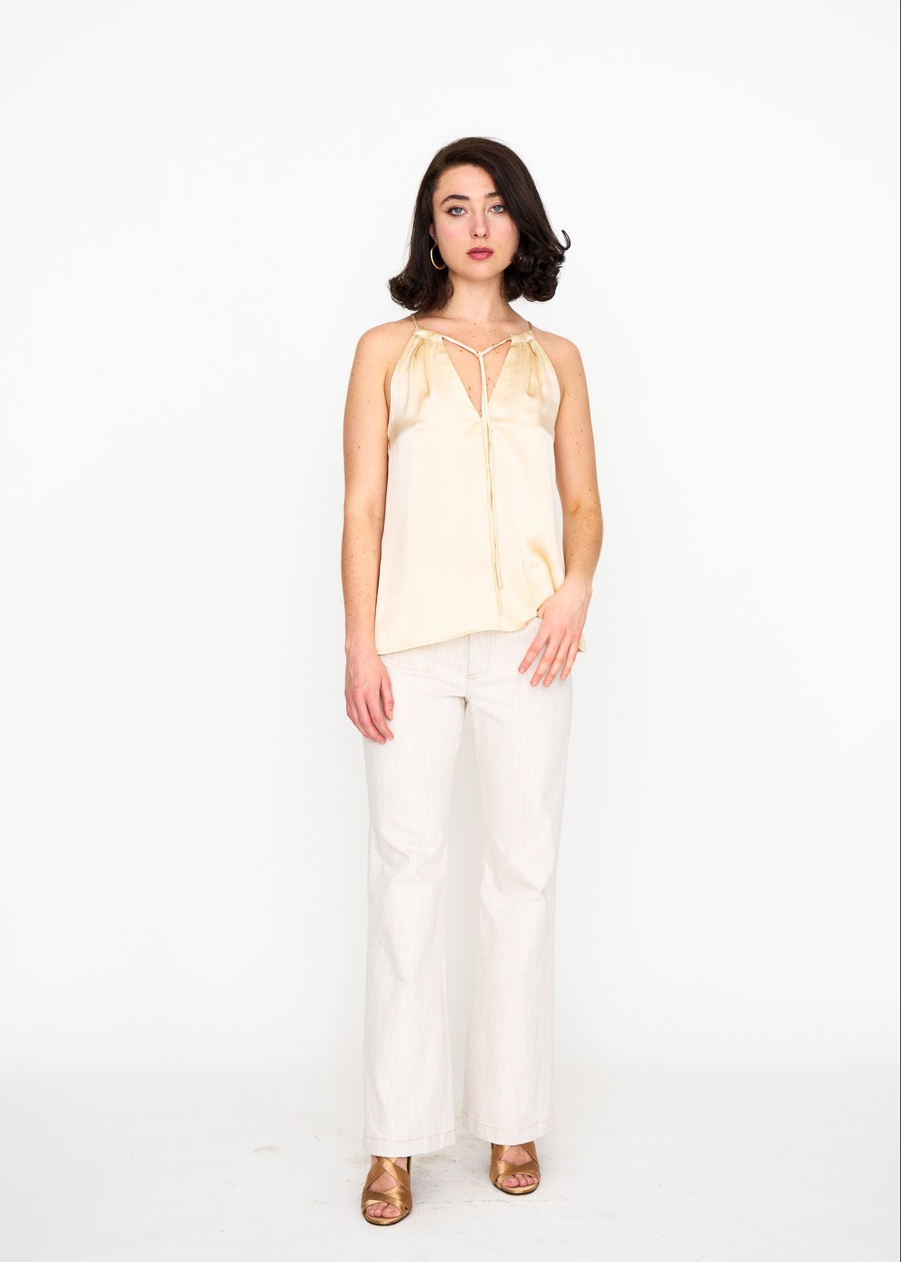 Woman wearing the Maria Cecilia Ecru Satin Halter Top, front view