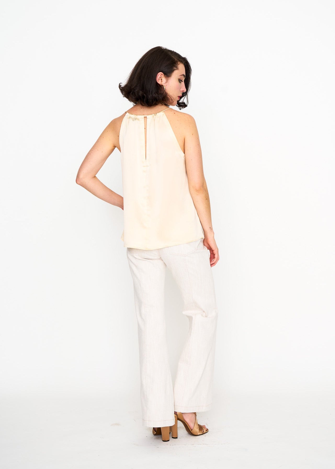 Ecru Satin Halter Top shown on model, side view