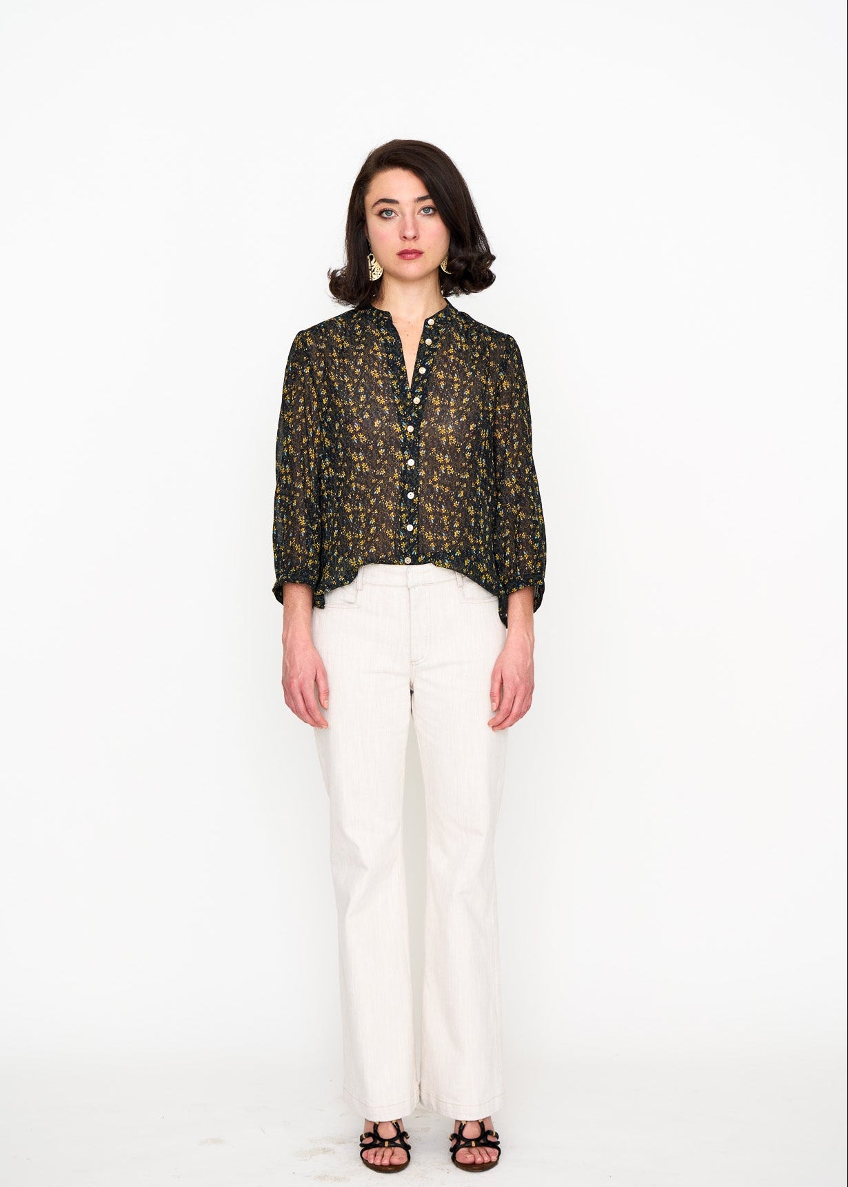Black Floral Studio Top shown on model, close-up detail