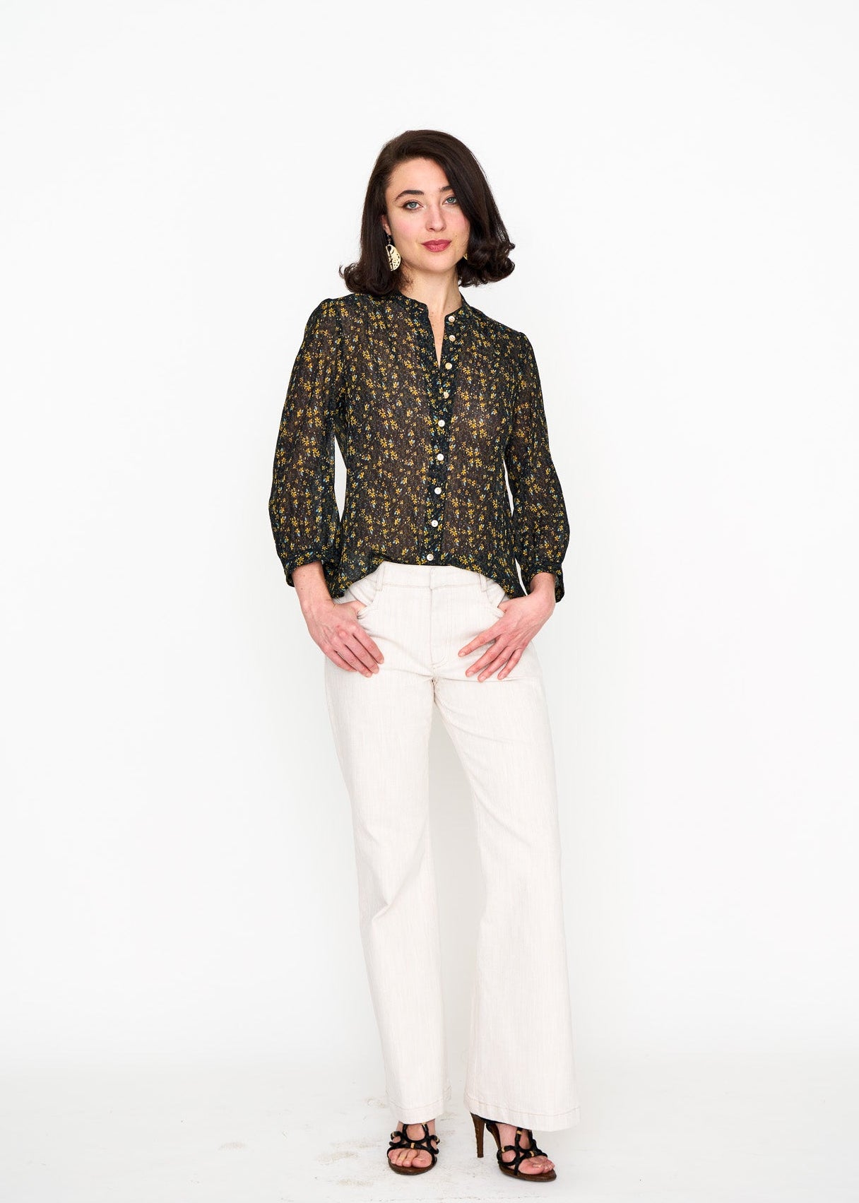 Black Floral Studio Top shown on model, detail view