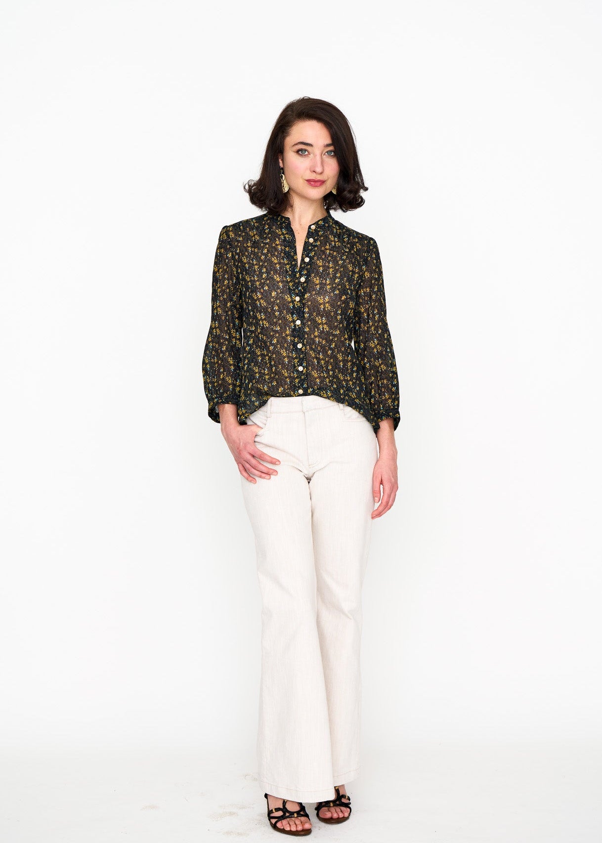 Black Floral Studio Top shown on model, back view