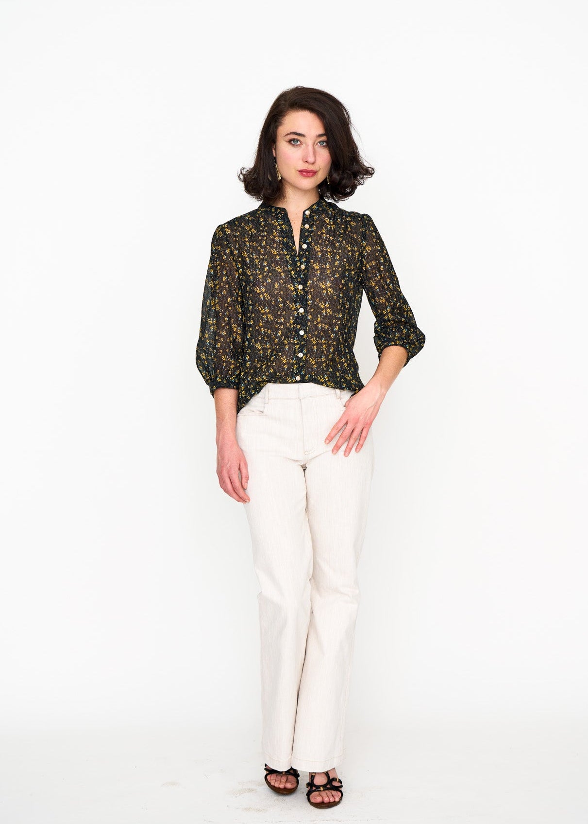 Woman wearing the Maria Cecilia Black Floral Studio Top, front view