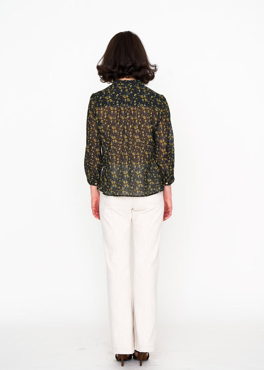 Black Floral Studio Top shown on model, side view