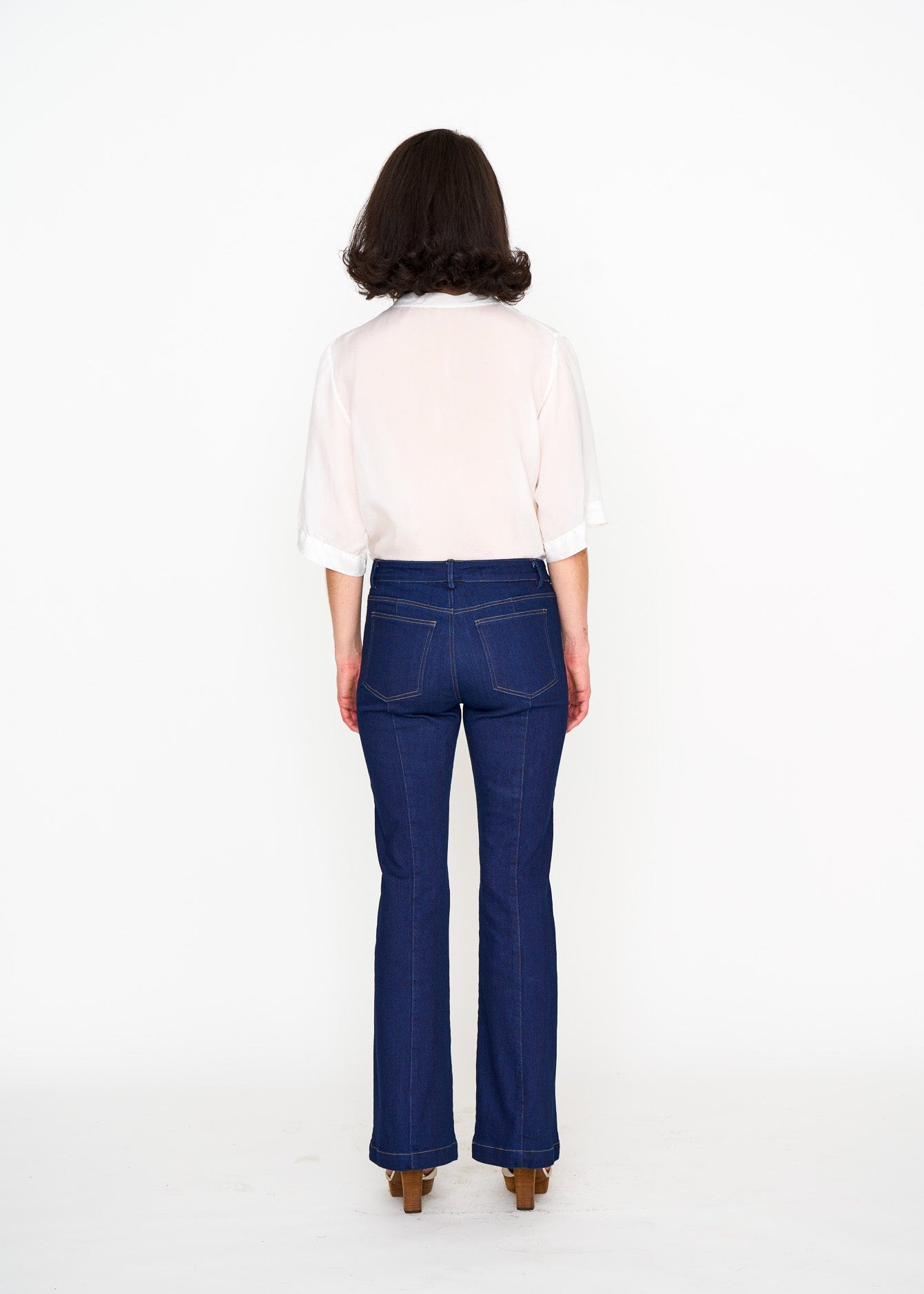 White Silk Tee shown on model, detail view