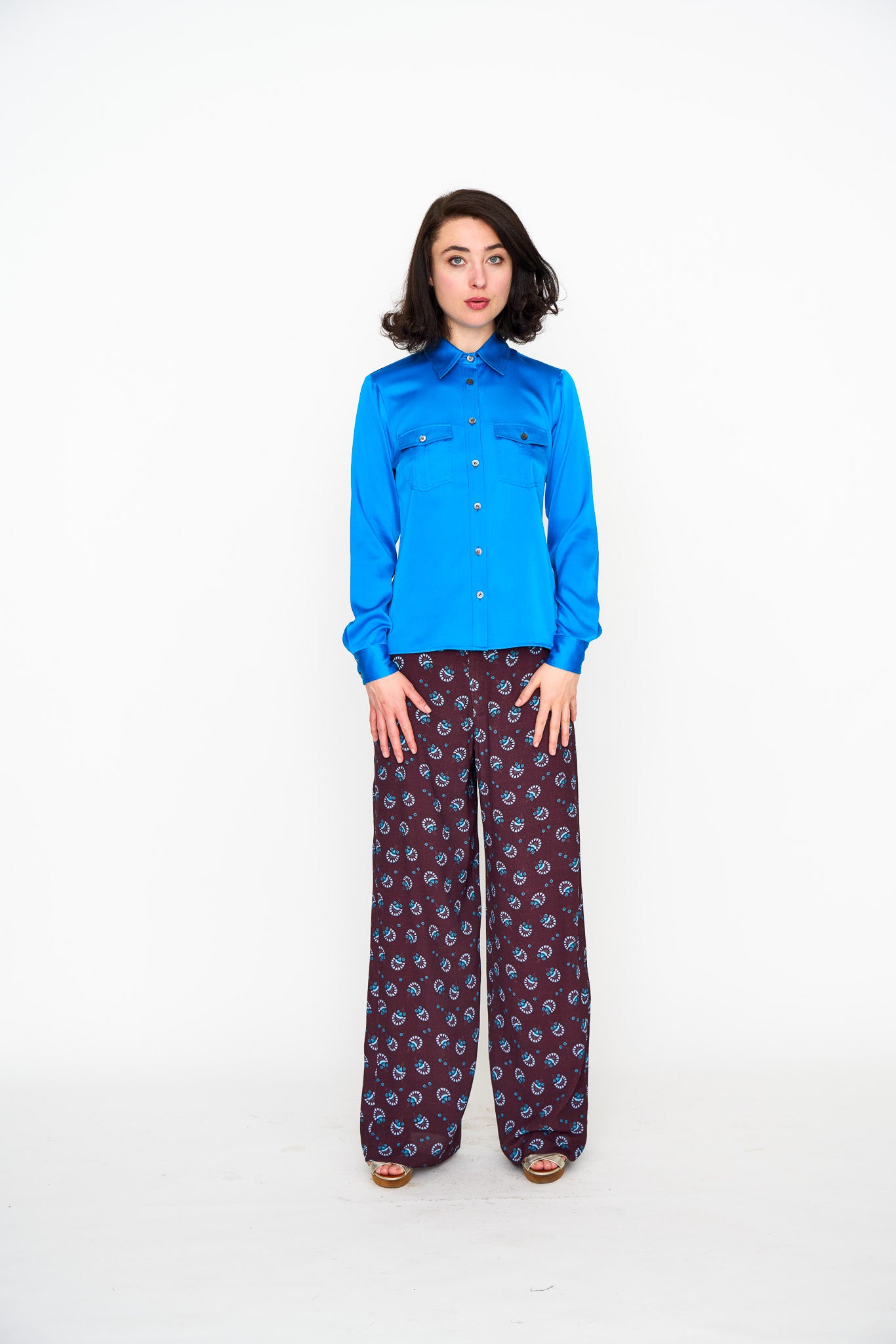 Woman wearing the Maria Cecilia Deep Zircon Silk Utility Shirt, front view