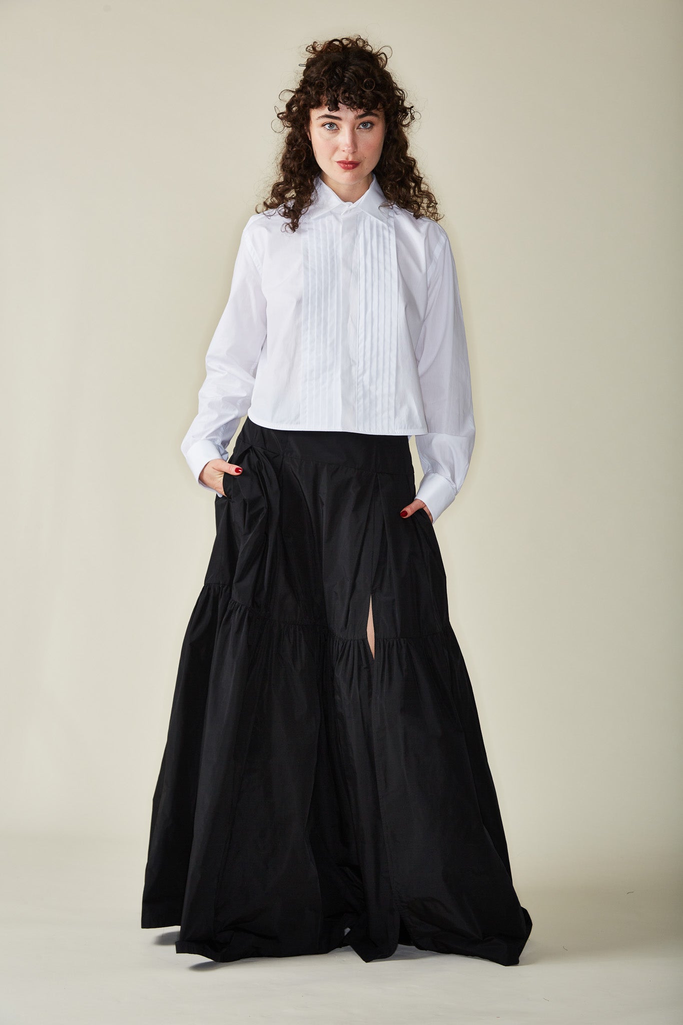 white button down women's shirt with a long black tiered skirt