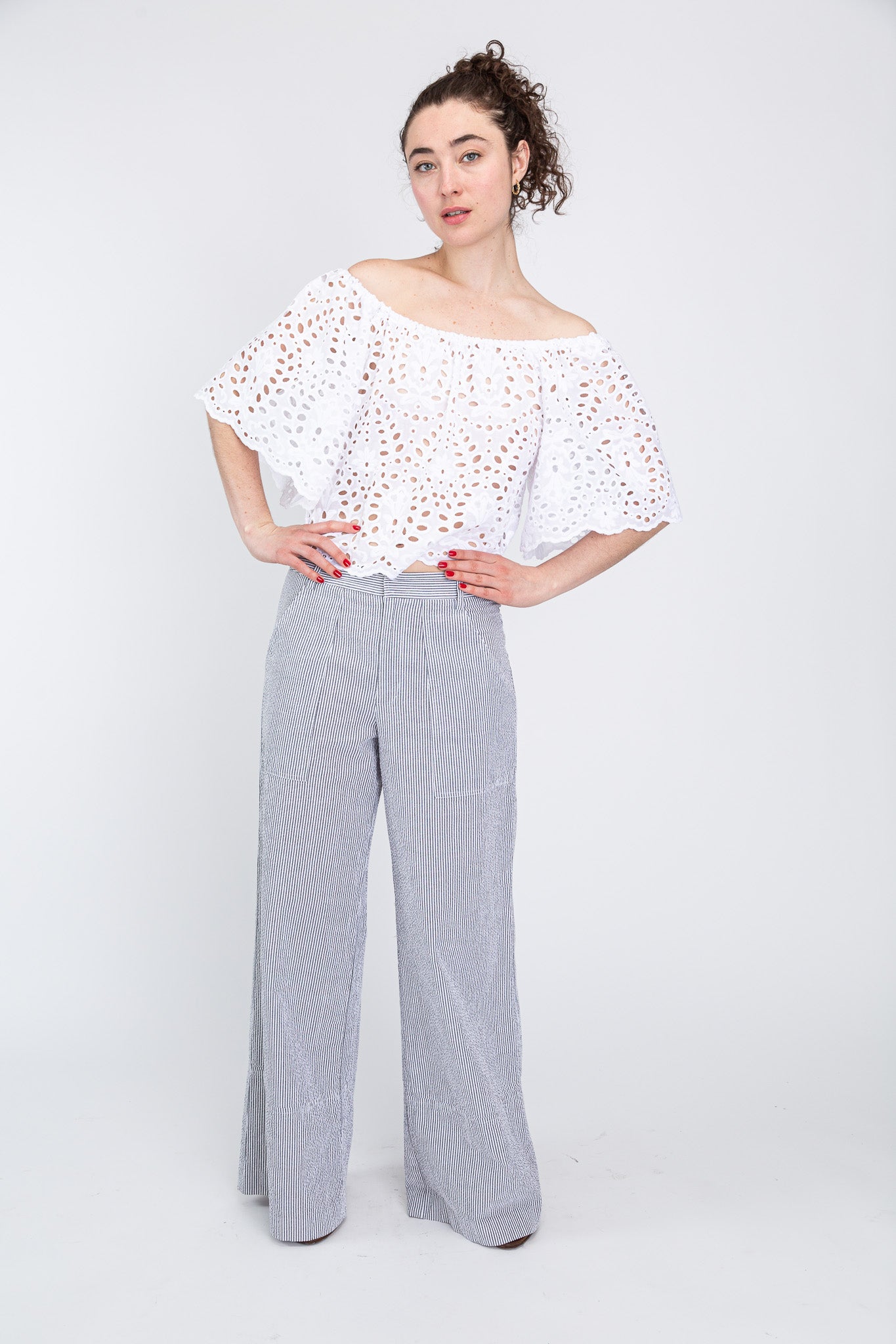 white eyelet top paired with seersucker pants